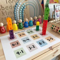 a wooden table topped with lots of toys and building blocks on top of each other