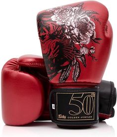 a pair of red boxing gloves sitting on top of each other