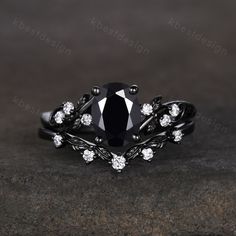 a black diamond ring with white diamonds on it