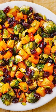 brussel sprouts, brussels sprouts and cranberries in a white bowl