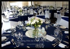 the tables are set with white and blue linens for an elegant wedding or special event