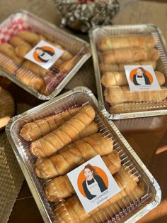 three trays filled with pastries sitting on top of a table