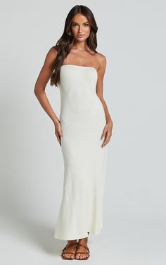 Get ready to turn heads in the Jenara Knitted Midi Dress. This strapless, off-white dress is a must-have for any fashion-forward individual looking to make a statement. The knit design adds a trendy touch, while the midi length keeps it classy and chic. Made from soft viscose fabric, this dress offers both style and comfort. Whether you're heading out for a casual brunch or attending an evening event, the Jenara Knitted Midi Dress is sure to elevate your look and give you that confident boost yo White Strapless Stretch Maxi Dress, Confident Boost, Knitted Midi Dress, Classy Dresses, White Strapless Dress, Off White Dresses, Strapless Neckline, Knit Midi, Knit Midi Dress