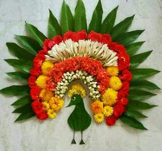 an arrangement of flowers arranged in the shape of a rainbow