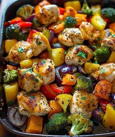 chicken and veggies in a pan ready to be served for the dinner guests