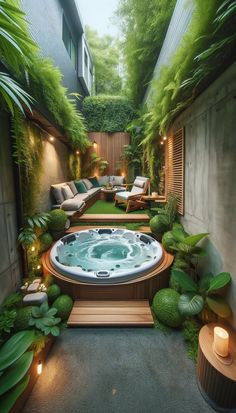 an outdoor hot tub surrounded by greenery and lights in the middle of a courtyard