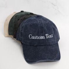 two hats with the words custom text on them