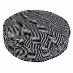 a black and white pattern on a round cushion