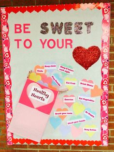 a bulletin board with hearts on it and the words be sweet to your teacher written in red