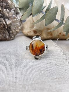 This is a very cool looking plume agate stone. It looks like a little fire! Set in sterling silver and hand stamped detailing around the bezel as well as on the band.  This ring is size 7. This ring was handmade by me in my studio. Southwest Aesthetic, Island Jewelry, Plume Agate, Fire Ring, Handmade Sterling Silver Rings, Wax Casting, Lost Wax Casting, Rings Cool, Lost Wax