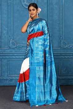 Beautiful cream and turquoise blue Pochampally ikkat silk saree is a perfect drape for parties and festive occasions. It comes with a matching blouse piece. Disclaimer: The shown stitched blouse on the model is for display purpose only. The saree comes with a matching blouse piece and finished with fall and piko. Silk Sarees Kanchipuram, Tussar Silk Sarees, Indian Clothing Store, Latest Designer Sarees, Fashion Journals, Tussar Silk Saree, Kanchipuram Saree, Traditional Fabric, Ikkat Silk Sarees