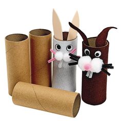 three toilet paper rolls with bunny and rabbit faces on them, one is made out of cardboard