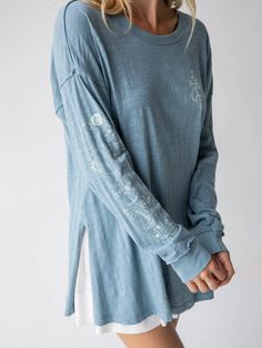 It’s looks like an artist just doodled all over an oversized long sleeve t-shirt…. Oh, they did!! Inspiring notes and artistic graphic details are printed all over this fun, casual shirt -- the front chest, long sleeve, and even on the back hemline! It’s the little things that matter! Side slits on the tunic length hem Athletic Outfit, Light Blue Long Sleeve, Long Sleeve Outerwear, Blue Tee, Natural Life, Blue Long Sleeve, Bohemian Clothes, Boho Vibe, Tunic Length