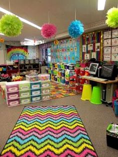 the classroom is decorated with bright colors and pom poms