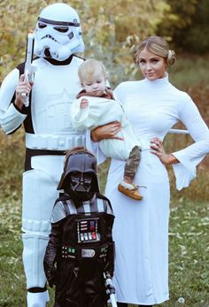 two women and a baby dressed up as darth vader and stormtrooper