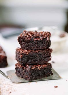 three chocolate brownies stacked on top of each other