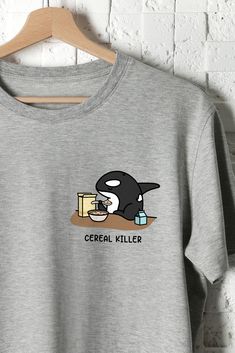 This "Cereal Killer" unisex t-shirt is perfect for any orca lover! The material is 100% Organic ring-spun combed cotton. The inks used in the print are water-based and non-toxic. Available in White and Grey. Available in sizes XS - XXL. Kawaii Crew Neck Top With Funny Print, Funny Cat Print Short Sleeve Tops, Orca Shirt, Black Cat Tee Shirts, Cereal Killer, Horror Skull Print Crew Neck T-shirt, Crewneck Design, Fun Sweatshirts, Cute Shirt Designs