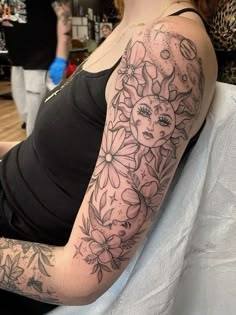 a woman with a tattoo on her arm