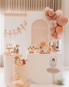 a ballerina themed birthday party with pink and gold decorations, balloons and cake stands