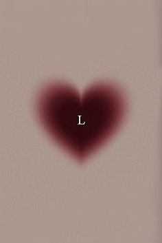 a heart shaped object with the letter l on it