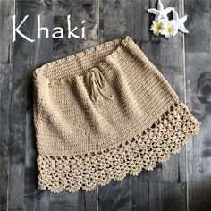 a crocheted skirt with the words khaki written in white on it