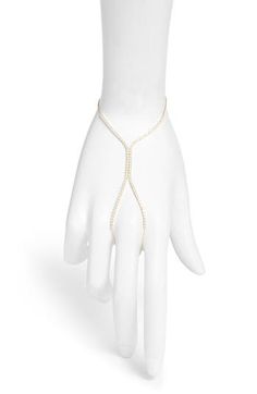 This tennis-inspired hand chain wraps you up in sparkling cubic zirconia. 6" wrist length; 2" extender Sterling silver or sterling silver and 14k-gold plate/cubic zirconia Imported Adjustable Cubic Zirconia Chain Jewelry, Elegant Hand Set Cubic Zirconia Chain Bracelet, Adjustable Chain Bracelet With Sparkling Stones For Party, Adjustable White Jewelry With Diamond Accents, Elegant Flexible Jewelry For Parties, Adjustable Cubic Zirconia Chain Bracelet For Party, Adjustable Pearl Chain Body Jewelry As A Gift, Elegant White Metal Body Jewelry, Cubic Zirconia Hand Set Chain Bracelet For Wedding