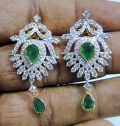 18 K solid gold Diamond and Emerald gemstone set earrings. Beautiful pair for your jewelry collection. Size -4/2 cm, weight of pair-13.390 grams, Diamond weight -2.82 carats, material -18 K solid gold , VS G diamond and natural Emerald. Green Diamond Pierced Earrings, Green Hallmarked Diamond Earrings For Gift, Dazzling Green Hand-set Earrings, Fine Jewelry Hand Set Green Earrings, Traditional Prong Setting Earrings As Gift, Fine Jewelry Hand-set Green Earrings, Green Hand-set Diamond Earrings As Gift, Traditional Earrings With Prong Setting As Gift, Dazzling Green Sterling Silver Earrings