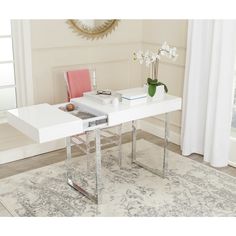 a white desk with clear legs in front of a window and rug on the floor