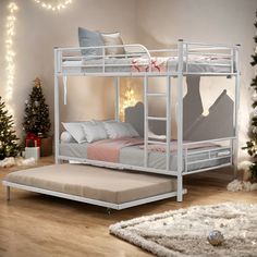 a white bunk bed sitting on top of a wooden floor next to a christmas tree