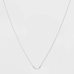 Add sparkle to your neckline with this Silver Sterling Cubic Zirconia Curved Bar Necklace from A New Day™. This dainty chain-style necklace makes a great jewelry piece for accessorizing. Neatly set with cubic zirconia studs on a curved-shaped base, it adds beauty and shine to your attire. Complete with a traditional spring ring clasp for secure fastening, it's easy and comfortable for all-day wear. Pair with coordinating drop earrings and a range of work blouses, casual tops or dresses to make a Awards Dress, Blouses Casual, Bar Station, Silver Necklace Simple, Toll House, Curved Bar, Solitaire Necklace, Fudge Recipe, Fashion Vocabulary