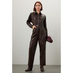 Brown faux leather (100% Polyurethane). Jumpsuit. Long sleeves. Collar. Front button closure. 26.5" from shoulder to hemline. 14" rise. 19" leg opening. Imported. Fitted Faux Leather Jumpsuits For Fall, Fitted Faux Leather Jumpsuits And Rompers For Fall, Leather Jumpsuits And Rompers For Fall, Fitted Faux Leather Jumpsuit For Work, Fall Workwear Jumpsuits And Rompers With Belt Loops, Brown Jumpsuits And Rompers For Fall Workwear, Brown Jumpsuits And Rompers For Work In Fall, Jumpsuit Long, Marissa Webb