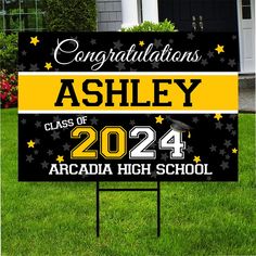 graduation yard sign with yellow and black stars