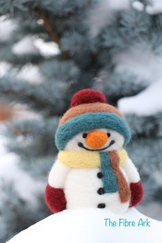 a snowman with a hat and scarf on