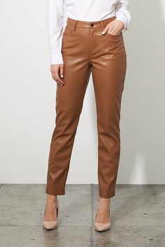 This pant features a faux leather construction, ultra-soft to the touch. Joseph Ribkoff's classic five-pocket design offers the utmost versatility for a chic finish. Perfect for the office or a night out on the town, this style effortlessly completes any outfit. Color - Nutmeg. Back pockets. Front pockets. Zipper and button closure. Belt loops. Joseph Ribkoff silver tag. Straight leg design. Fabric- 55% Polyurethane. 45% Polyester. Sleek Brown Leather Bottoms, Business Casual Leather Pants Straight Leg For Fall, Leather Pants With Faux Front Pockets For Work, Fitted Leather Pants With Faux Front Pockets, Sleek Tapered Leg Leather Pants For Work, Sleek Tapered Leather Pants For Work, Chic Faux Leather Pants For Business Casual, Sleek Tapered Leg Leather Pants For Fall, Faux Leather Straight Leg Pants For Business Casual