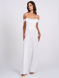 We wanted something soft, clean, and elegant so Sherlyn is what we created! Cut from a soft stretch crepe this fully lined jumpsuit is a must add to your summer white wardrobe. Featuring a boned corset bodice, silk pleated draping details, and a straight leg fit with a flared hem. This sleek jumpsuit channels iconic energy. Boned Corset Bodice Draping Shoulders Flared Leg Materials: Stretch Crepe / Silk Pleated / Boned Corset Length: Approx 52.3inch / 140cm lnside Seam Length of Trousers: Approx Fitted Jumpsuits And Rompers For Gala In Summer, Fitted Summer Jumpsuits And Rompers For Gala, Fitted Jumpsuits And Rompers For Summer Gala, Fitted Strapless Jumpsuit For Summer Gala, Elegant Strapless Elastane Jumpsuit For Party, Fitted Floor-length Strapless Jumpsuit For Evening, Elegant Floor-length Strapless Jumpsuit For Formal Occasions, Elegant Formal Floor-length Strapless Jumpsuit, Elegant Evening Elastane Pantsuit