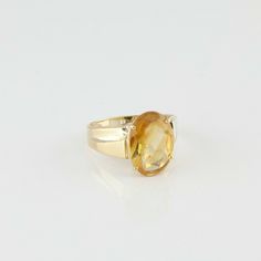 "10K Yellow Gold Yellow and Citrine Solitaire Oval Ring, 10x16mm oval, 4 prong set, stepped bypass setting, 5/8\" across, Ring size 9, Circa 1970, 3.4 grams SKU# BB244R11 This listing contains photographs of the actual item you will receive. Our items are in excellent condition with little or no signs of wear and many are one of a kind pre-owned estate finds. Please look closely at the pictures in this listing as they are part of the product description. Please read the description, as any imper Yellow Oval Topaz Ring In 14k Gold, Oval Faceted Rings In Fine Jewelry Style, Formal Oval Cabochon Topaz Ring, Oval Faceted Rings For Anniversary, Classic Oval Topaz Ring With Prong Setting, Classic Oval Topaz Ring For Anniversary, Fine Jewelry Yellow Oval Topaz Ring, Classic Oval Solitaire Topaz Ring, Heirloom Oval Faceted Ring