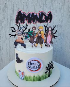 a white cake with some cartoon characters on it