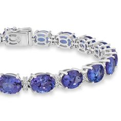 Product Information SKU NY6309/5 Metal Type 14K Metal Color White Gold Bracelet Style - Primary Stone Gemstone Name Tanzanite Gemstone Species Zoisite No. Of Gemstones 30 Gemstone Shape Oval Gemstone Color Blue Gemstone Grade - Gemstone Clarity - Gemstone Weight 25.3 cts Gemstone Size 8x6 Gemstone Treatment - Origin Tanzania Secondary Stone Gemstone Name Diamond Gemstone Species Diamond No. Of Gemstones 38 Gemstone Shape Round Gemstone Color - Gemstone Grade - Gemstone Clarity - Gemstone Weight Tanzanite Bracelet, White Gold Bracelet, Tanzanite Gemstone, Ring Style, Blue Gemstones, Metal Color, Diamond Gemstone, Bracelet Sizes, White Gold Rings