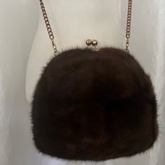 This Genuine Sabble Fur Crossbag Has One Compartment And Closes With A Clip, It’s A Very Light To Wear And You Can Also Warm Your Hands. Golden Hardware. Removable Chain Crossbody Strap. It’s In Excellent Condition Elegant Evening Bags For Winter, Elegant Winter Evening Bags, Winter Evening Bag With Top Handle, Elegant Rectangular Shoulder Bag With Faux Fur Lining, Luxury Bags With Faux Fur Lining For Winter, Rectangular Shoulder Bag For Winter Evenings, Winter Evening Shoulder Bag With Faux Fur Lining, Elegant Brown Bag For Winter, Winter Evening Rectangular Shoulder Bag