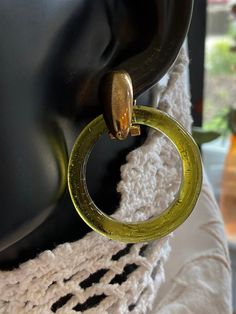 4 Pairs of interchangeable Peking Glass ring earrings. These earrings are unique and versatile. The glass rings are in excellent, vintage condition. This is a fun group, with many possibilities. When the earrings are shown on the mannequin, the hook does not sit well. On actual ears, the bottom hinge does not show. Vintage Nickel-free Small Hoop Earrings, Vintage Small Hoop Earrings, Vintage Gold Glass Earrings, Vintage Single Clip-on Earring In Metal, Vintage Single Round Earring, Vintage Round Metal Clip-on Earrings, Vintage Hoop Clip-on Earrings For Gift, Vintage Hoop Earrings For Gift, Vintage Round Clear Jewelry