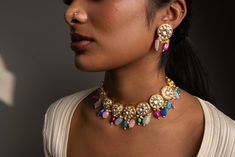 Inspired by the pastel colors of spring, our Kanali Jewelry Set will bring a lovely array of colors to your look. Featuring unique stones, and Kundan on Gold-Plating this dainty set is the perfect add to your collection. Specifications Materials used: kundan, Stones, Gold-Plating At Romikas, we pride ourselves on the craftsmanship and high quality of our jewelry, designed to enhance your natural beauty. Please contact us with any questions. Fusion Style Kundan Necklace With Stones, Fusion Kundan Necklace, Multicolor Gemstone Jewelry Sets For Weddings, Multicolor Jeweled Kundan Necklace In Fusion Style, Multicolor Jeweled Kundan Fusion Necklace, Multicolor Kundan Necklace With Gemstone For Bollywood, Multicolor Kundan Necklace With Gemstones In Bollywood Style, Bollywood Style Multicolor Gemstone Kundan Necklace, Multicolor Fusion Kundan Necklace