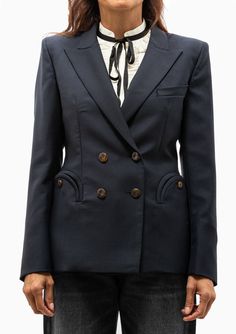 Blazé Milano's versatile, all-season wardrobe Essential, the First Class Navy Charmer Blazer in a light wool-mohair blend shows sharp shoulders and a waist-cinching slim fit. Featuring a double breasted front, lightly padded shoulders, glossy loden inspired buttons, peak lapels, one internal pocket and smiley outer pockets. It layers over any look or pairs as a suit with the coordinating pants. 71% Virgin Wool 29% Mohair | Lining: 100% Viscose Dry Clean Only Made in Italy Model is 5’8” and weari Sharp Shoulders, Cinched Waist, First Class, Wardrobe Essentials, Smiley, Double Breasted, Dry Clean, Slim Fit, Blazer