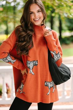 We think it's going to be a quick decision for you to put this cute sweater in your cart! It's obviously cute with that tiger print but it's also super cozy making it perfect for the fall! This mock neck sweater is going to look so cute with skinny jeans and boots or booties! Mock neckline Long fitted sleeves with drop shoulders Side slits Tiger print Generous stretch Sydney is wearing the small. Tiger Sweater, Orange Tiger, Floral Cocktail Dress, Fitted Sleeves, Black Tie Dress, Long Sleeve Outerwear, Two Piece Swimwear, Cute Sweater, Rust Orange