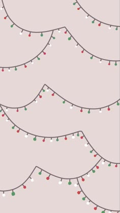 a christmas tree with lights on it is in the middle of a pink wallpaper