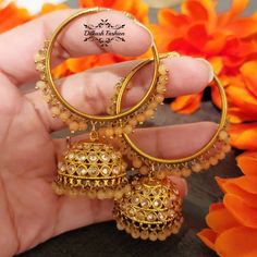 "Gorgeous, handcrafted gold & light orange meenakari waali jhumkis! The earrings are 3 \" long & 2 \" wide. Picture is taken in natural room light. Please contact if you have any questions. Thanks! Color, shades, texture displayed may slightly vary from the actual product due to digital image limitations. We request you to consider these minor variations. Please expect the possibility of some slight imperfections when buying hand made jewelry. If you have any questions, please contact us." Gold Jhumkas For Festive Occasion, Traditional Meenakari Hoop Earrings For Diwali, Traditional Cutdana Hoop Earrings As Gift, Handmade Round Chandbalis For Diwali, Round Meenakari Hoop Earrings For Festivals, Gold Chandbalis With Cutdana, Round Hoop Earrings With Meenakari For Diwali, Round Hoop Earrings With Meenakari For Festivals, Gold Jhumkas With Latkans