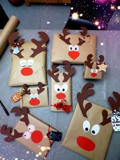 christmas presents wrapped in brown paper with reindeer faces on them