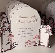 some white and pink cards with flowers on them