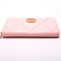 This Chanel 19 Quilted Goatskin Long Zip Around Wallet is . The exterior is in the classic Chanel Goatskin leather. Condition: Very Good Serial Number: L3HT5X01 Color: Pink Exterior: The exterior leather is free of any rips or cracks. The zipper fabric has minor discoloration. Hardware: The zip closure operates properly and runs smoothly. Interior: The interior is clean and free of rips or tears. The interior features one zip closure pocket, eight card slots, and two bill slots. Dimensions: L: 7 Classic Chanel, Chanel 19, Chanel Purse, Chanel Earrings, Celine Bags, Chanel Black, Fendi Bags, Chanel Handbags, Flap Bag