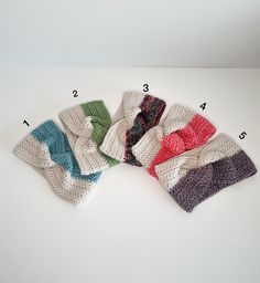 six knitted headbands with numbers on each side and four different colors in the middle