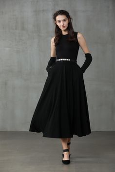 "Winter days do not mean that you need to resign to elegance. Boasting a soft wool-blend construction, this spiral skirt from Linennaive proves that you can be elegant and warm at the same time. Featuring a high waist, a rear zip fastening, a flared style, side pockets and a midi-length. 【Material】 -Wool 87%, Elastane 13% 【Length】 32-33 inches. 【Size】 *SIZE XS length: 32\"/82 cm waist: 26\"/ 66 cm *SIZE S length: 32\"/82 cm waist: 27\"/ 70 cm *SIZE M length: 32\"/82 cm waist: 29/ 75 cm *SIZE L l Black Winter Dresses With Lined Skirt, Black Winter Dress With Lined Skirt, Black Lined Winter Dress, Winter Black Dresses With Lined Skirt, Winter Evening Maxi Skirt With Lining, Long Evening Skirt For Winter, Winter Evening Midi Skirt, Winter Evening Long Skirt, Evening Long Winter Skirt